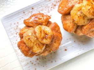 These Easy Monkey Bread Muffins with Banana Pudding are perfectly sized for individual fingers and only require 5 ingredients! Made with cinnamon, biscuit dough and banana pudding, they are an easy and fun party dessert to serve both kids and adults!