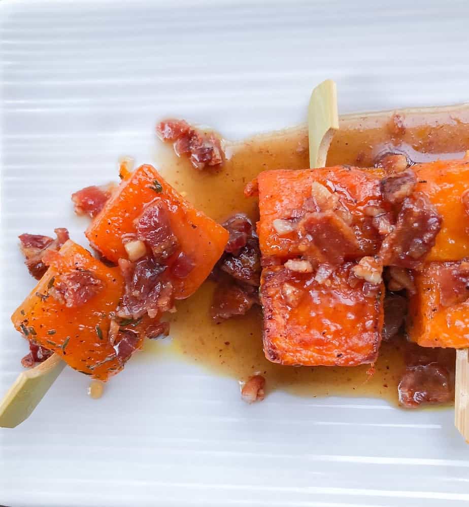 Maple bacon squash skewers! This easy bite sized appetizer is perfect for your next party! The best finger foods for a crowd! Sweetened with brown sugar and maple syrup, they are packed with flavor! #squash #bacon #skewers #appetizer #fingerfoods #partyfood