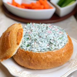Cream cheese spinach dip in bread bowl