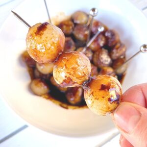 pearl onions with balsamic vinegar on a toothpick skewer