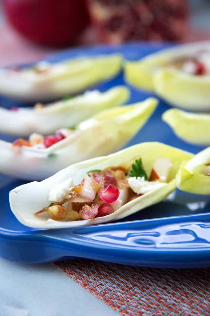 endive leaves stuffed with pancetta and pomegranate seeds