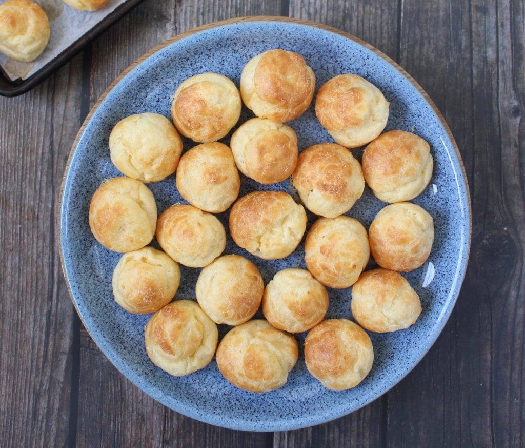 cheese gougeres on a blue dish